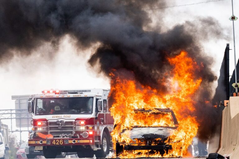 Firetruck Next to Burning Car on Street